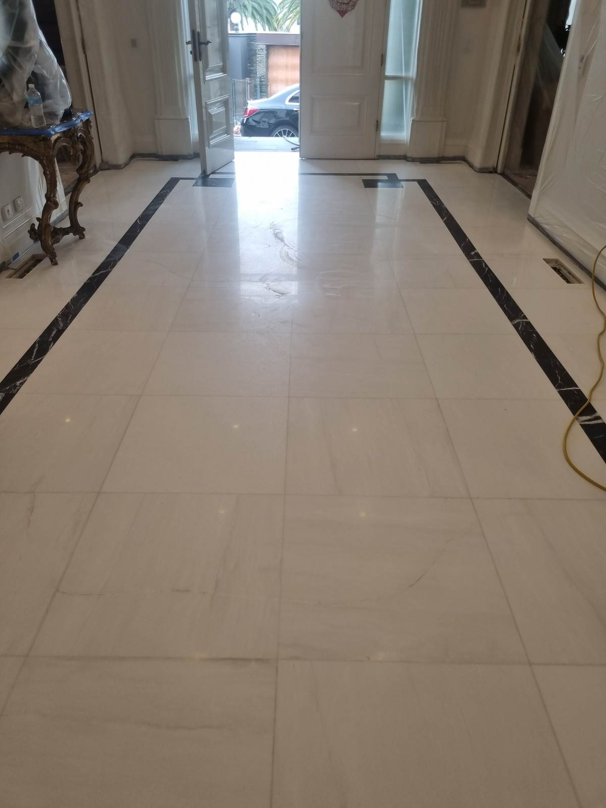 Before — white marble hallway dull