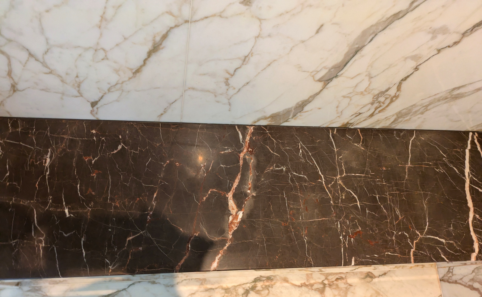 After — dark marble border polished