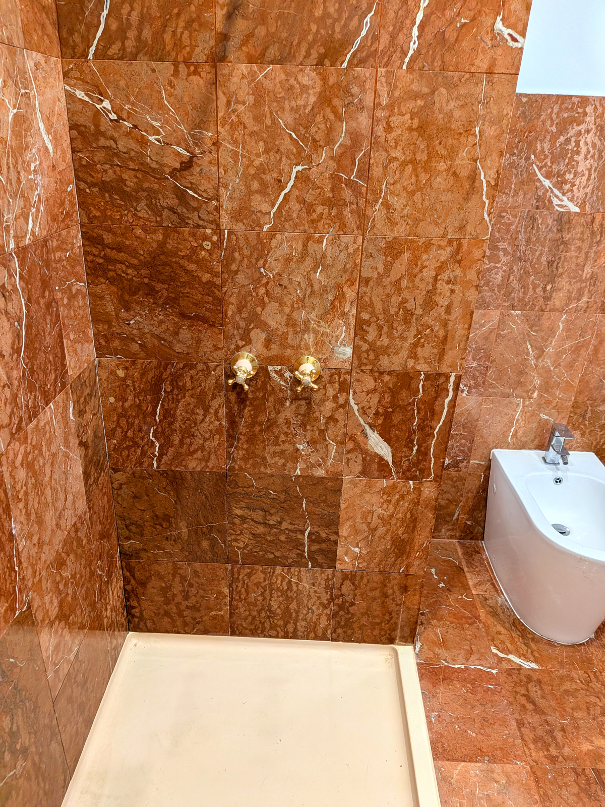 After — red marble bathroom second angle